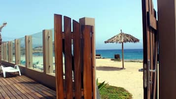 On the beach, sun loungers, beach towels