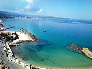 On the beach, sun-loungers, beach towels