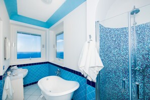 Bathtub, hair dryer, bidet, towels