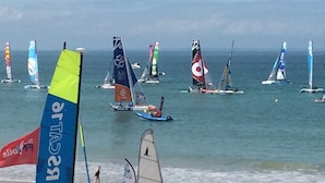 A coastal scene with multiple sailboats on the water, indicating a sailing event or popular sailing spot. - Luxury Family Farmhouse, Pool and Games Room. Perfect for DDay, Mont st Michel (Le Mesnil-Garnier)
