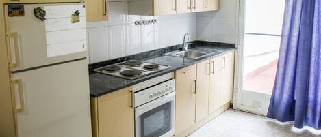 Fridge, oven, coffee/tea maker, cookware/dishes/utensils