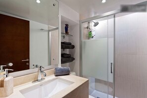Shower, hair dryer, towels, soap