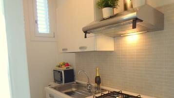 Fridge, microwave, dining tables