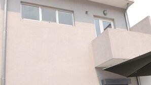 A modern building with a flat facade, large windows, and a balcony. - RENDEZ VOUS PORTO I (T1) (Paranhos - Porto)
