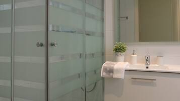 Shower, hair dryer, towels, soap