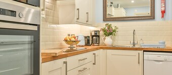 Ruim appartement met 1 slaapkamer op de begane grond met uitzicht op de achtertuinen.