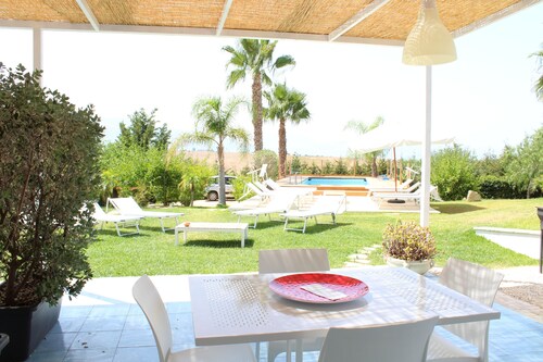 Sea apartment in villa with swimming pool.