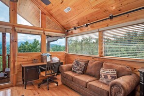 Televisio, takka, DVD-soitin, pöytäjalkapallopöytä