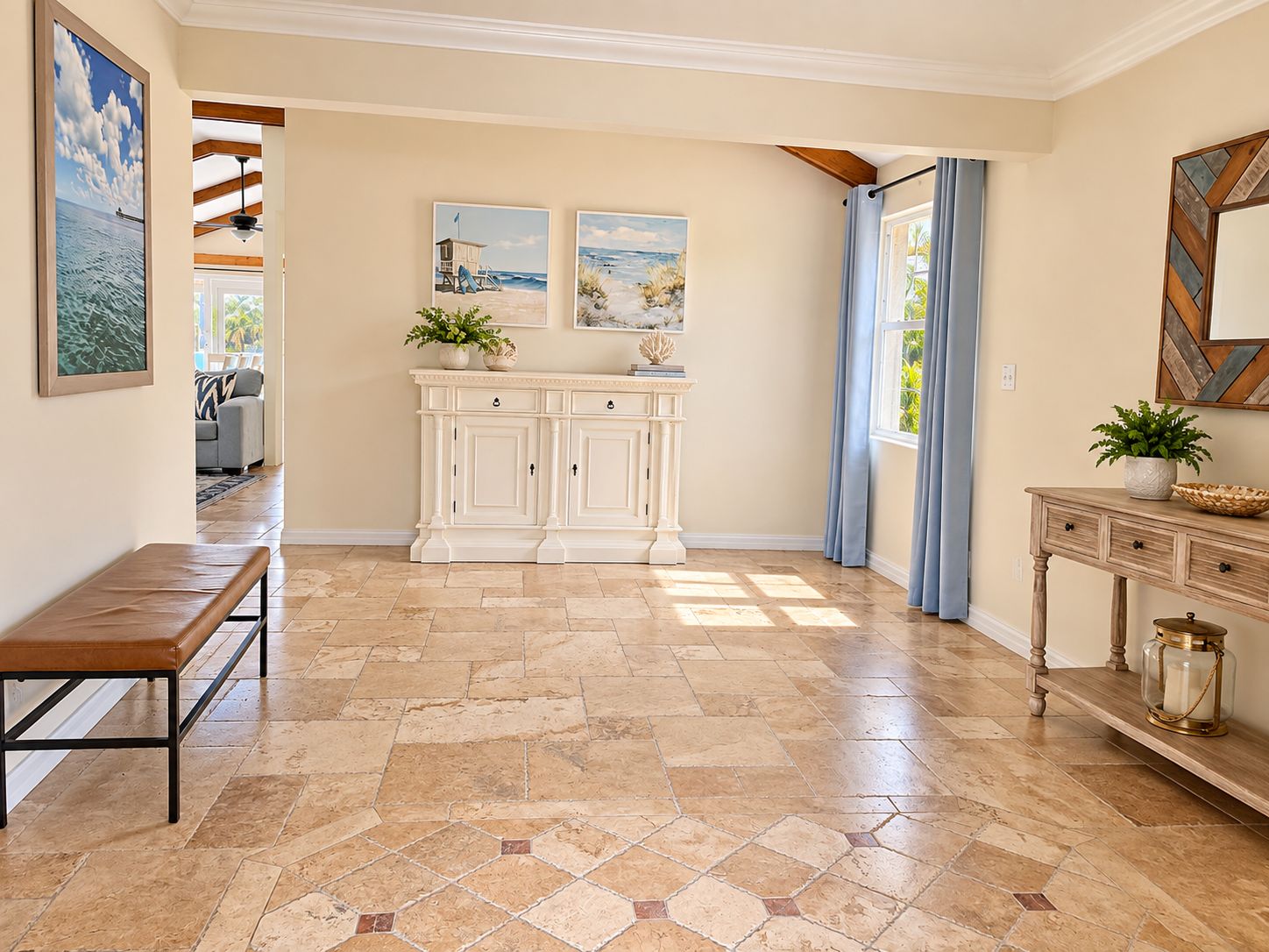 A spacious hallway with a bench, a white console table, and a decorative cabinet.