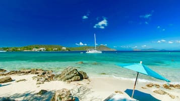 On the beach, sun loungers, beach towels
