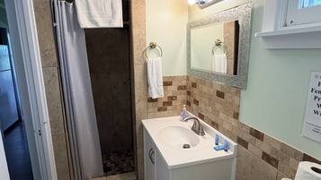 Shower, towels, soap, toilet paper