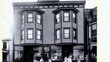 Mrs. Annie Martz building features a charming bay window design and storefronts below.