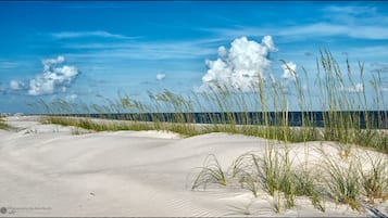 On the beach, sun loungers, beach towels