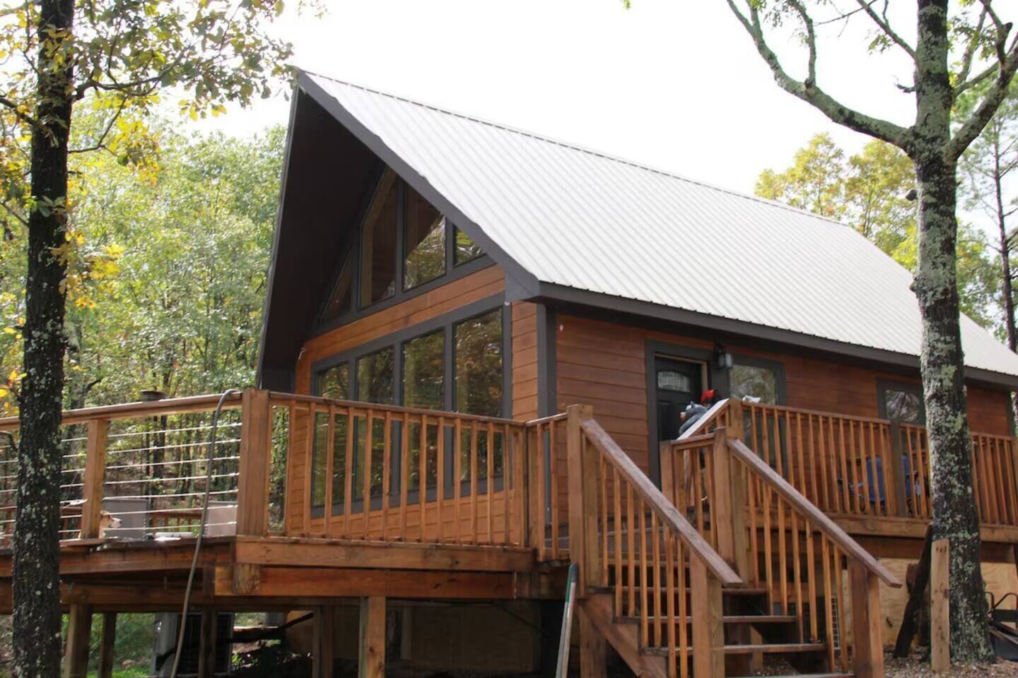 “Cliffside serenity awaits—savor sweeping lake views from the rugged peace of your private deck.”