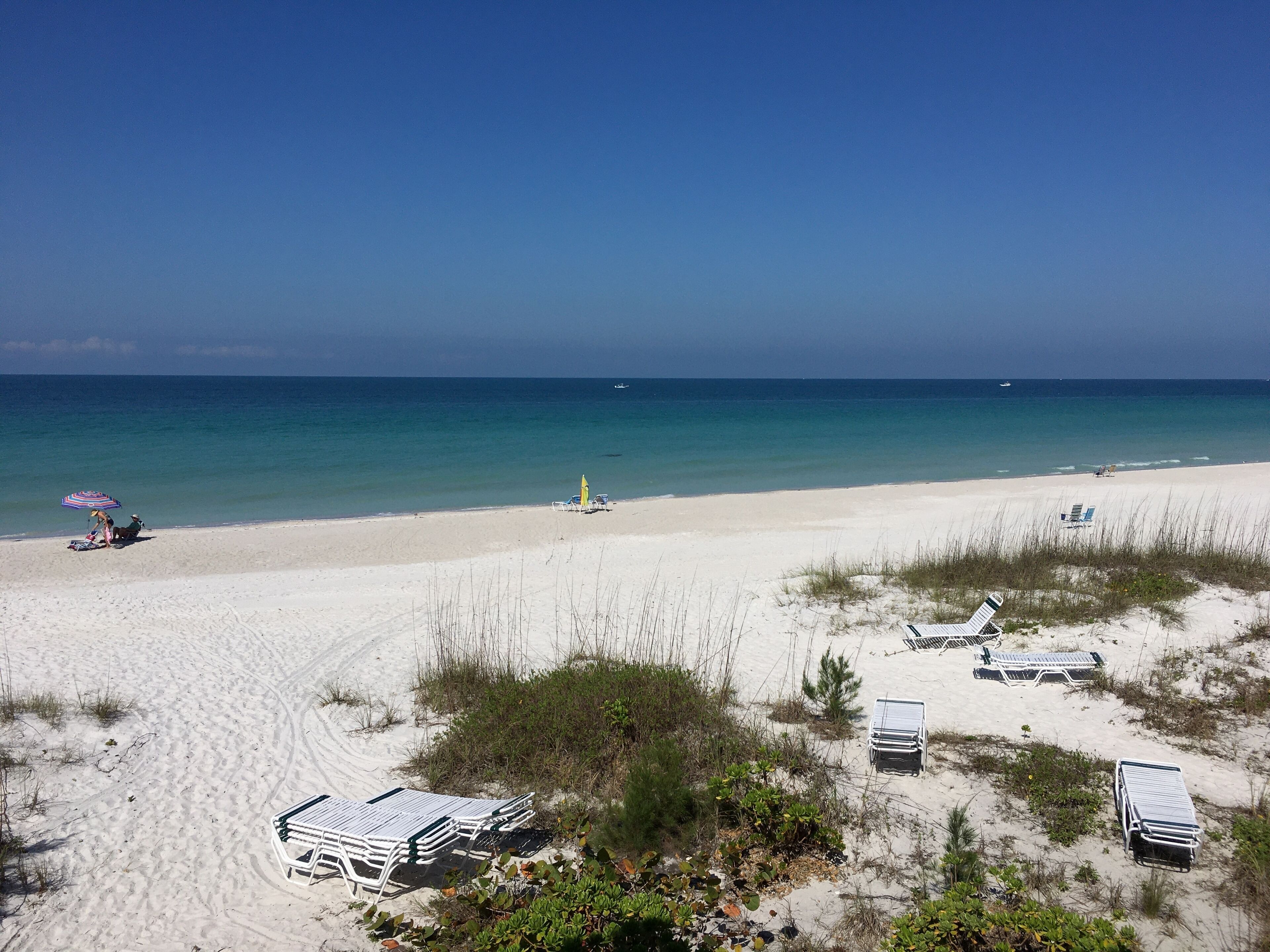 On the beach, sun loungers, beach towels
