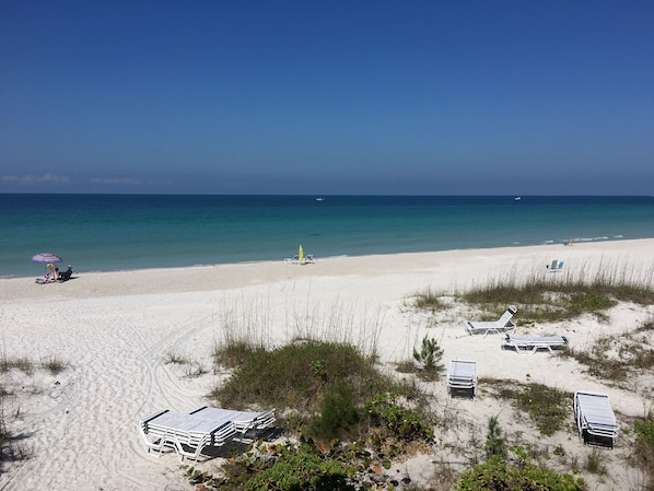 On the beach, sun loungers, beach towels