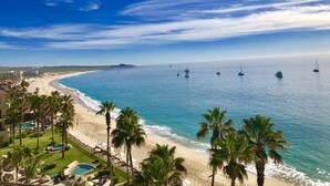 A coastal resort with a beach, palm trees, and a pool area. - Villa La Estancia Resort-Medano Beach GORGEOUS, LUXURY 2 bd+3 bath private villa (Cabo San Lucas)