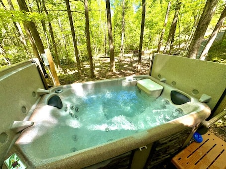 Outdoor spa tub. Tiny Owl cabin- Tranquil Forest Retreat with Hot Tub and Creekside Setting