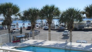 A pool area with a view of the marina and boats. - DESTIN HARBORWALK BEST LOCATION in DESTIN with Boatdock (destin)