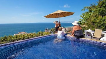 A rooftop pool, a heated pool