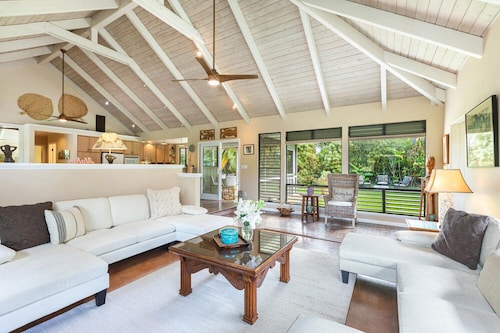 Walk to the beach in this lush, serene house with a private garden oasis