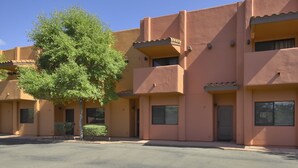 A multi-story building with a flat roof and a tree in front. - Vacation Townhome - Hot Tub, Red Rock Views, Walk to Dining/Trails (Sedona)