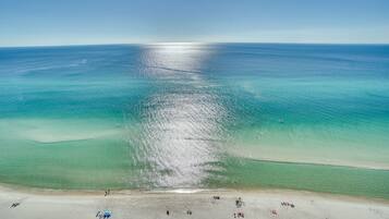 On the beach, sun-loungers