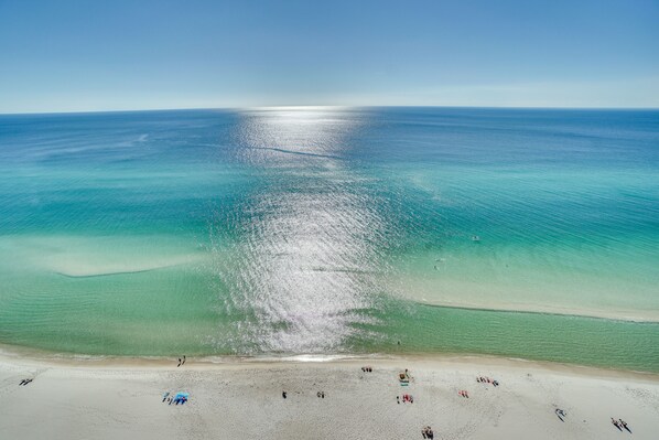 On the beach, sun-loungers