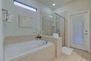 Bathtub, hair dryer, towels, soap