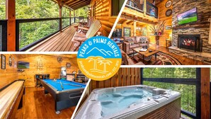 A cozy cabin with a wooden interior, a pool table, a hot tub, and a fireplace.