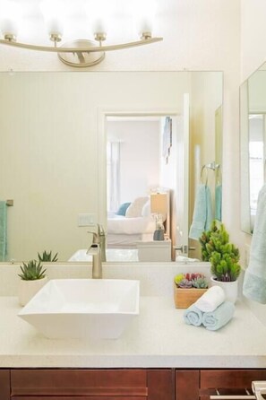 Bathtub, hair dryer, towels, soap