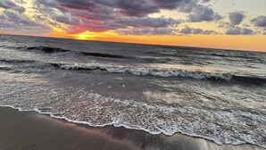 A beach with waves and a sunset. - Beachfront Historic home 2br/1Ba apt. w/  Steam Shower, WiFi, Netflix, Disney+  (Dunkirk)