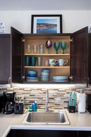 A kitchen with a built-in cabinet containing various glassware and dishes. - Updated: Luxury Villa, Amazing Views with Pool + Generator (Nazareth)