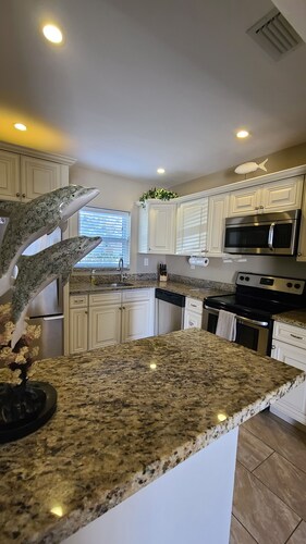 Apt A,  Beach block beauty with putting green. Everything for a great Vacation, 