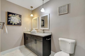 Shower, hair dryer, towels, shampoo