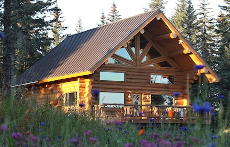 Exterior. Unique Alaskan log home in trees & wild flowers on 14-acre private homestead.