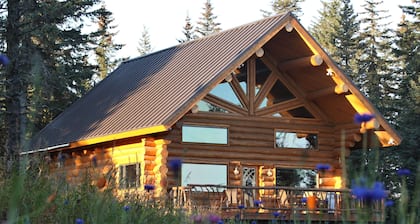 Unique Alaskan log home in trees & wild flowers on 14-acre private homestead.
