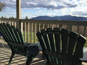Two Adirondack chairs on a wooden deck overlooking a mountainous landscape. - Peaceful, Family Friendly, Heated Outdoor Pool, Awesome Views, Near Story Land (Bartlett)