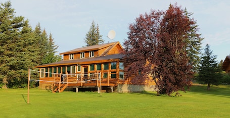 Exterior. Unique Alaskan log home in trees & wild flowers on 14-acre private homestead.