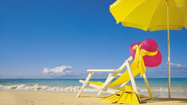 A beach chair and umbrella on a sandy beach with a clear blue sky and ocean in the background. - Naples Best Value Luxury 4 Bedroom Heated Pool Spa Bikes Spacious Backyard (Naples)