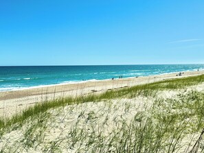 On the beach, sun-loungers