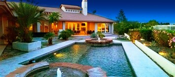 Evening view with landscape lights to set the mood