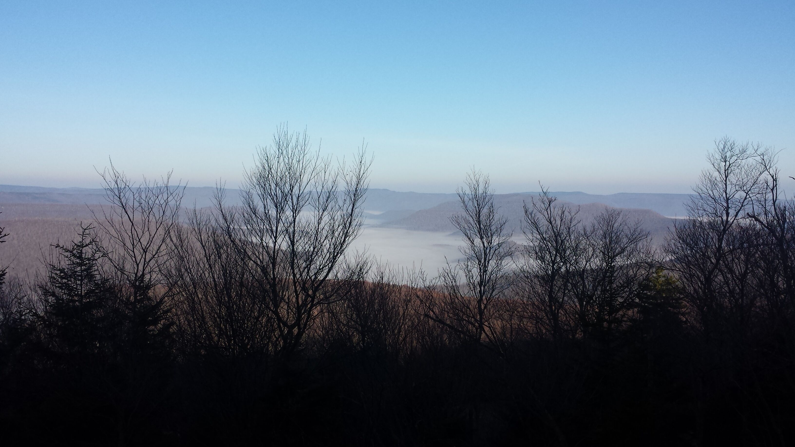 A mountainous landscape with a clear sky.