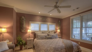 A bedroom with a bed, two bedside tables, a ceiling fan, and a window with blinds. - WOW! 30% Off Until Oct. 1st | Walk to Ritz, Golf Front, 3 King Beds, Book Now (Greensboro)