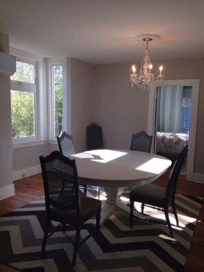 Enjoy meals in this elegant dining room with a round table and four chairs.