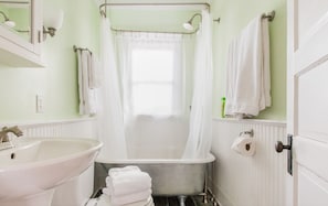 Combined shower/tub, hair dryer, towels, soap