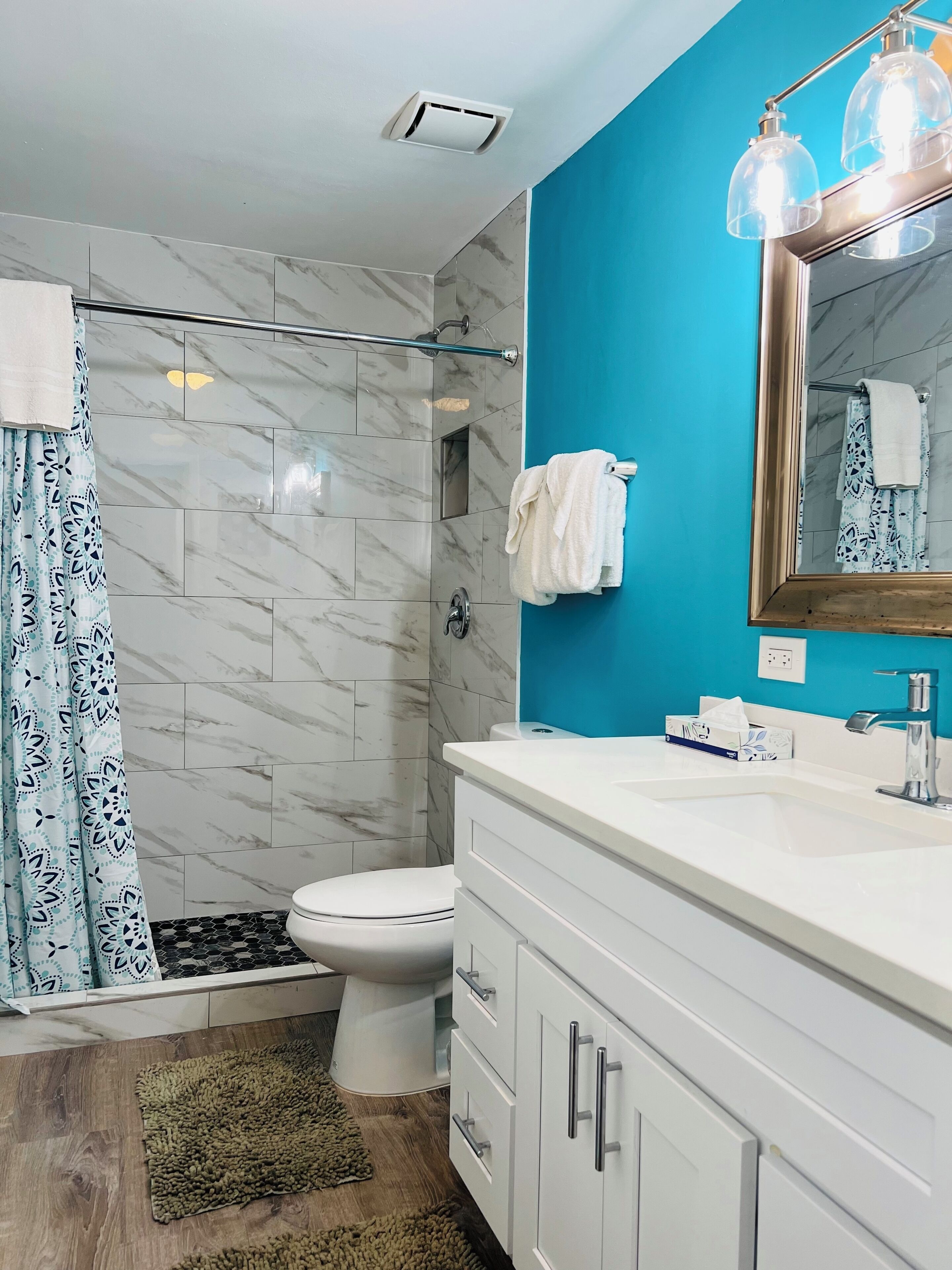 Bathtub, hair dryer, towels, soap