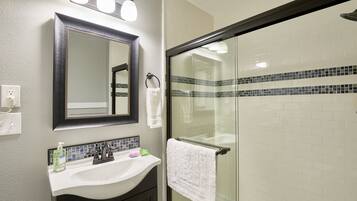 Shower, hair dryer, towels