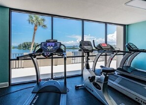 Work out with a serene view of the palm tree and body of water.