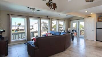 Flat-screen TV, DVD player, books, video library